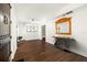 Bright and airy living room featuring hardwood floors, white walls, and modern decor at 8205 Overlook Ne Pl, St Petersburg, FL 33702