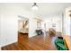 Open-concept living area with hardwood floors and views into the dining and living areas at 8205 Overlook Ne Pl, St Petersburg, FL 33702