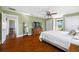 Main bedroom with wood floors and a large window at 8205 Overlook Ne Pl, St Petersburg, FL 33702