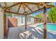Enjoy outdoor living with a refreshing pool, covered gazebo, and lush greenery at 8205 Overlook Ne Pl, St Petersburg, FL 33702