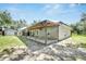 Spacious backyard with a large covered patio, perfect for outdoor entertaining and relaxation at 9017 S County Line Rd, Lithia, FL 33547