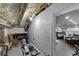 Unfinished basement space with household items, shelving and access to another finished room at 9017 S County Line Rd, Lithia, FL 33547