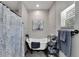 Charming bathroom featuring a freestanding tub, stylish fixtures, and decor at 9017 S County Line Rd, Lithia, FL 33547