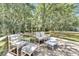 Relaxing deck area features cozy seating and lush greenery, perfect for outdoor gatherings at 9017 S County Line Rd, Lithia, FL 33547