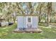 Small outbuilding on a wooden platform, offering versatile space for storage or hobbies at 9017 S County Line Rd, Lithia, FL 33547