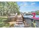 This pool deck features stairs to the pool, lounge chairs and a view of the lush landscaping at 9017 S County Line Rd, Lithia, FL 33547