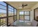 Relax on your screened lanai with ceiling fan and views of a lake and community at 9860 62Nd N Ter # 1051, St Petersburg, FL 33708
