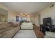 Open concept living area boasts wood-look floors, comfortable seating, and access to a dining area at 9860 62Nd N Ter # 1051, St Petersburg, FL 33708