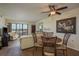 Open living room with lots of natural light, hardwood floors, and a ceiling fan at 9860 62Nd N Ter # 1051, St Petersburg, FL 33708