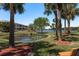 Beautiful water view of mature trees and a tranquil pond in a well-maintained community at 9860 62Nd N Ter # 1051, St Petersburg, FL 33708