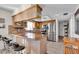 Kitchen featuring breakfast bar, stainless steel appliances, and travertine countertops at 10301 Gulf Blvd # 302, Treasure Island, FL 33706