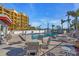 Inviting in-ground pool with an outdoor seating area and lounging chairs, perfect for relaxing at 10301 Gulf Blvd # 302, Treasure Island, FL 33706