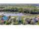 Aerial view of home on a large lot backing to a pond and protected wetlands at 10818 Breaking Rocks Dr, Tampa, FL 33647