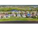 Aerial view of the house nestled in a community, backing onto a scenic pond and green spaces at 10818 Breaking Rocks Dr, Tampa, FL 33647