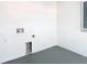 Unfinished basement featuring concrete flooring and white walls at 10818 Breaking Rocks Dr, Tampa, FL 33647