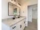 Bathroom featuring a double vanity and black hardware at 10818 Breaking Rocks Dr, Tampa, FL 33647
