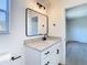 Bathroom vanity with granite counters, sleek fixtures, and natural light at 10818 Breaking Rocks Dr, Tampa, FL 33647