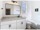 Bathroom featuring white vanity, black hardware, and subway tile shower at 10818 Breaking Rocks Dr, Tampa, FL 33647