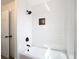 Bathroom with white tiled shower and black shower head at 10818 Breaking Rocks Dr, Tampa, FL 33647