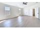 Spacious bedroom with fan, windows, and ensuite bathroom access at 10818 Breaking Rocks Dr, Tampa, FL 33647
