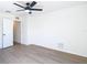 Bedroom with ceiling fan and wood-look floors at 10818 Breaking Rocks Dr, Tampa, FL 33647