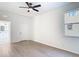 The bedroom has modern flooring, ceiling fan and ensuite bath access at 10818 Breaking Rocks Dr, Tampa, FL 33647