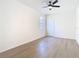 The bedroom has modern flooring, ceiling fan and lots of light at 10818 Breaking Rocks Dr, Tampa, FL 33647
