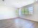 Bright bedroom with two windows and neutral flooring at 10818 Breaking Rocks Dr, Tampa, FL 33647