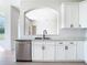 Bright kitchen showcasing white cabinets, granite countertops, and stainless steel appliances at 10818 Breaking Rocks Dr, Tampa, FL 33647