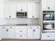 New white kitchen featuring granite countertops, stainless appliances, and shaker style cabinets at 10818 Breaking Rocks Dr, Tampa, FL 33647