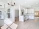 Open-concept kitchen with granite countertops, stainless steel appliances, and an open view to the living space at 10818 Breaking Rocks Dr, Tampa, FL 33647