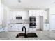 Well-equipped kitchen boasting granite countertops, stainless steel appliances, and ample storage at 10818 Breaking Rocks Dr, Tampa, FL 33647