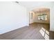 Bright open room with hardwood floors and a view through to the other room at 10818 Breaking Rocks Dr, Tampa, FL 33647