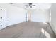 Bright main bedroom offers a ceiling fan, ensuite bath and lots of light at 10818 Breaking Rocks Dr, Tampa, FL 33647