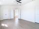 Bright main bedroom boasts modern flooring and ensuite bath access at 10818 Breaking Rocks Dr, Tampa, FL 33647