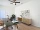 Bright home office with modern desk, stylish decor, and neutral color palette at 10818 Breaking Rocks Dr, Tampa, FL 33647