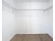 Spacious walk-in closet features ample shelving for optimal organization at 10818 Breaking Rocks Dr, Tampa, FL 33647
