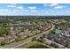 Scenic aerial view of a lovely community with lush landscaping, lakes, and well-maintained homes at 1120 Radison Ave # 6, Sun City Center, FL 33573