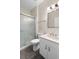 Well-lit bathroom with a modern vanity, marble floor tiles and a glass-enclosed shower at 1120 Radison Ave # 6, Sun City Center, FL 33573