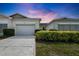 Charming single-story villa showcasing a well-maintained exterior, driveway, and manicured landscaping at 1120 Radison Ave # 6, Sun City Center, FL 33573