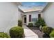 Inviting front entrance with manicured landscaping and walkway leading to the front door at 1120 Radison Ave # 6, Sun City Center, FL 33573