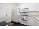 Functional kitchen with white appliances and ample counter space at 1120 Radison Ave # 6, Sun City Center, FL 33573