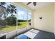 Enclosed patio featuring outdoor seating and pleasant views of the surrounding landscape at 1120 Radison Ave # 6, Sun City Center, FL 33573
