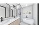 Modern bathroom featuring a soaking tub and glass shower at 1215 E Broad St, Tampa, FL 33604