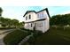 Charming two-story home featuring lush front yard landscaping at 1215 E Broad St, Tampa, FL 33604