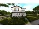 Inviting two-story home with manicured bushes and steps leading to the front entrance at 1215 E Broad St, Tampa, FL 33604