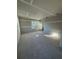 Bright living room featuring natural light from large windows and newly installed drywall at 1215 E Broad St, Tampa, FL 33604