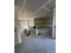 Spacious living room with an open floor plan, featuring sliding doors, and newly installed drywall at 1215 E Broad St, Tampa, FL 33604