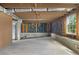 Unfinished basement with exposed beams, concrete floor and walls, and a view to the outside through the window at 1320 Coral S Way, St Petersburg, FL 33705