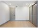 A spacious bedroom with a clean, neutral design and wood flooring, highlighted by a storage closet at 1320 Coral S Way, St Petersburg, FL 33705